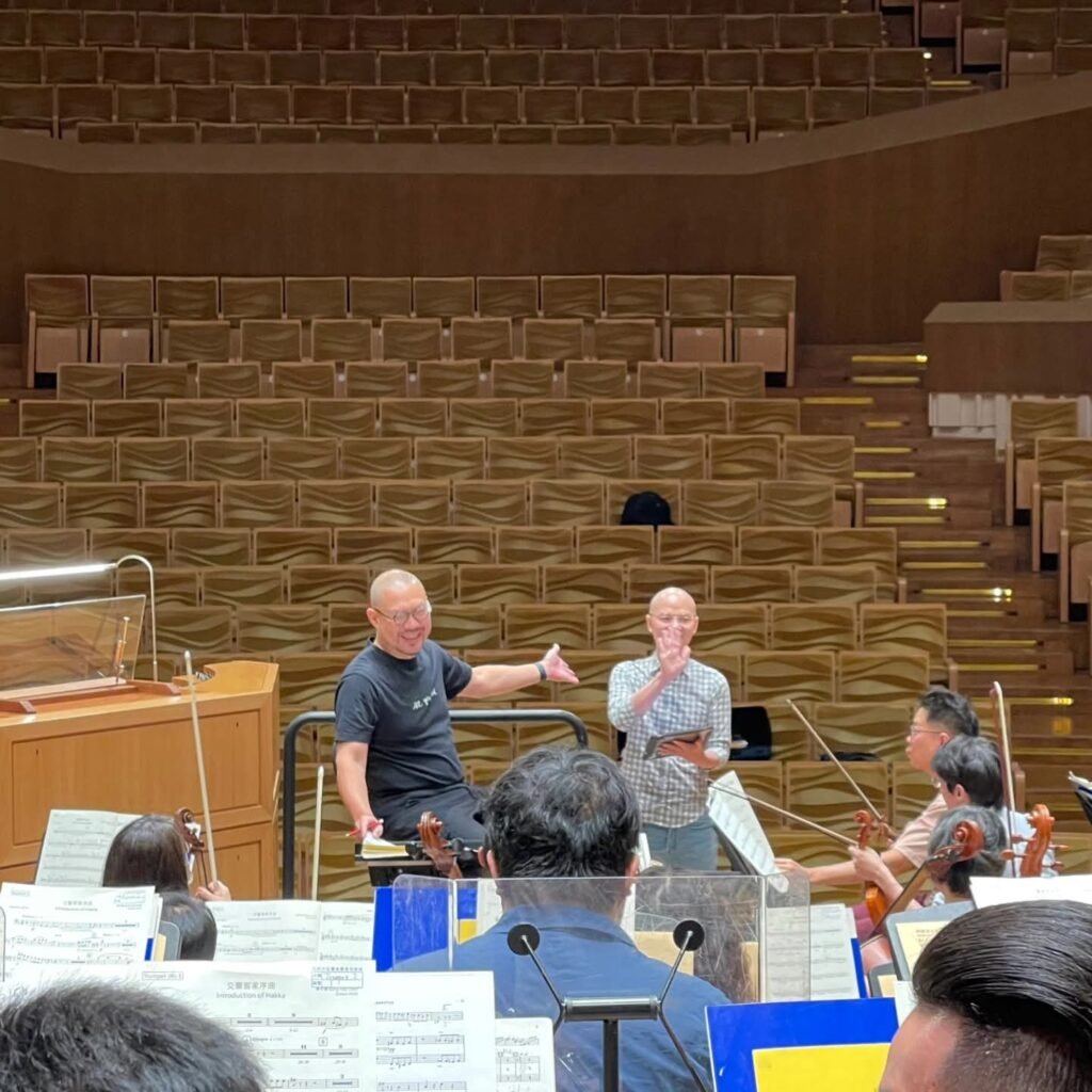 Taiwanese composer Bang-hau Liao in orchestral rehearsal with conductor Wen-pin Chien and musicians of Kaohsiung Symphony Orchestra